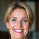 Professional headshot of Sara D., a satisfied female client in her late 40s.